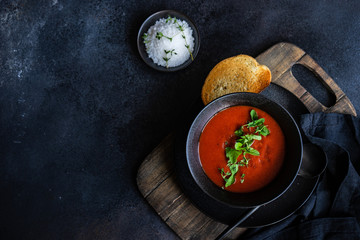 Gazpacho soup served in black bowl