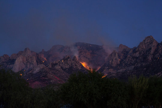 A Wildfire Burning Out Of Control In Rugged Mountains