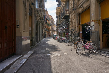 Sidestreet in Palermo Sicily with a bikeshop and typical life
