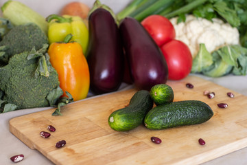 delicious fresh green cucumber on a beautiful blurry vegetables background