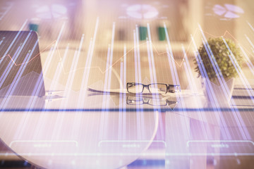 Double exposure of financial graph drawing and office interior background. Concept of stock market.