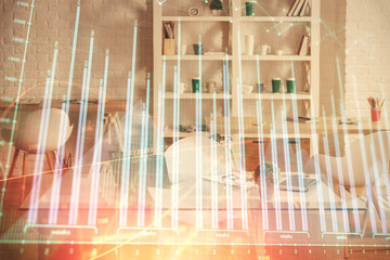 Double exposure of financial graph drawing and office interior background. Concept of stock market.