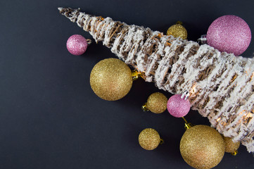 christmas tree with colorful toys on a black background