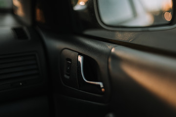 Car door handle, black interrior, metal handle design
