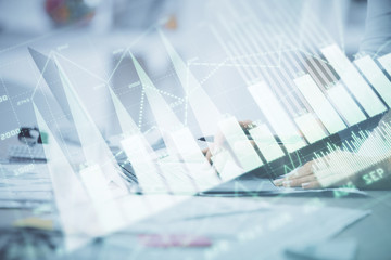 Double exposure of woman hands typing on computer and forex chart hologram drawing. Stock market invest concept.