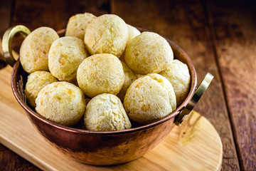Brazilian cheese bread, in copper pan, small bread baked in oven. Traditional delicacy from the state of minas gerais.
