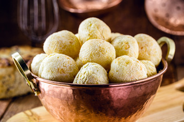 Brazilian cheese bread, in copper pan, small bread baked in oven. Traditional delicacy from the state of minas gerais.