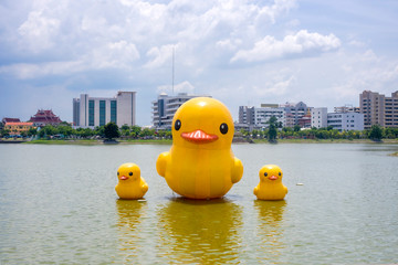 three Giant yellow rubber ducks in the lake of Udon thani province, Thailand