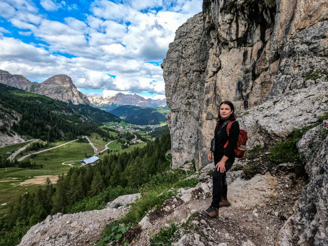 Woman hiker resting in Dolomites, Italy