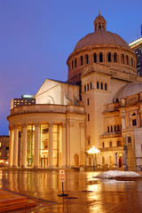 Fototapeta na wymiar The Christian Science church is reflected in the rainy plaza in Boston