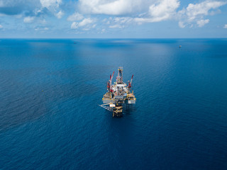 Aerial view from a drone of an offshore jack up rig at the offshore location during day time