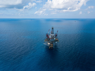 Aerial view from a drone of an offshore jack up rig at the offshore location during day time