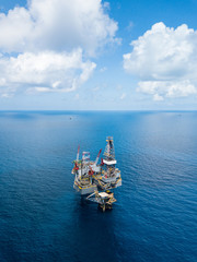 Aerial view from a drone of an offshore jack up rig at the offshore location during day time