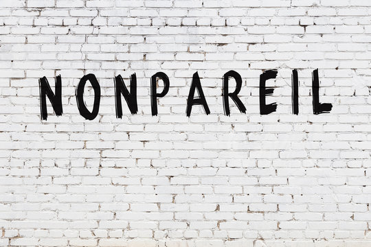 White wall with black paint inscription nonpareil on it