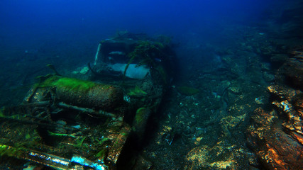 Abandoned car underwater in river