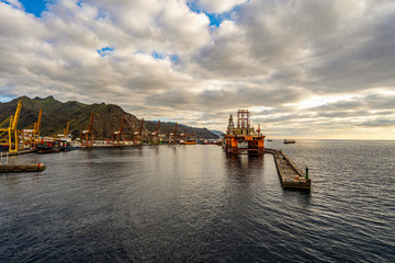 Fototapeta premium Vessels ready to start their voyage as they wait patiently in the quiet harbor