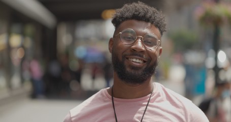 Young black man in city smile happy face portrait