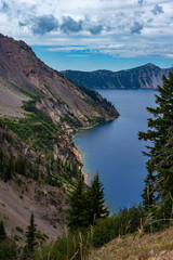 Fototapeta na wymiar A breath taking view of a steep majestic shoreline of Crater Lake