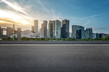 Fototapeta na wymiar Empty asphalt road along modern commercial buildings in China, s cities