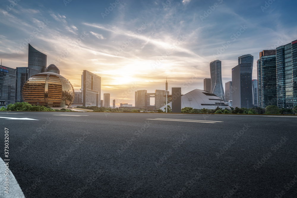 Wall mural empty asphalt road along modern commercial buildings in china, s cities