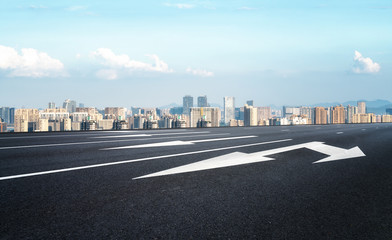 Empty asphalt road along modern commercial buildings in China, s cities