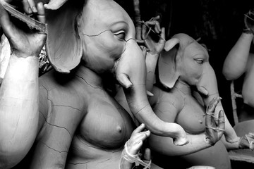 Clay idol of Hindu Lord Ganesh, under preparation for Bengal's Durga Puja festival at Kumartuli in...