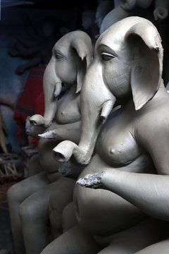 Clay idol of Hindu Lord Ganesh, under preparation for Bengal's Durga Puja festival at Kumartuli in Kolkata. Creative and Conceptual photography. 