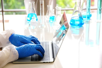 scientist working with laptop in laboratory
