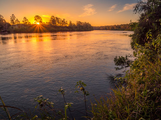 Beautiful Riverside Sunset with Reflections