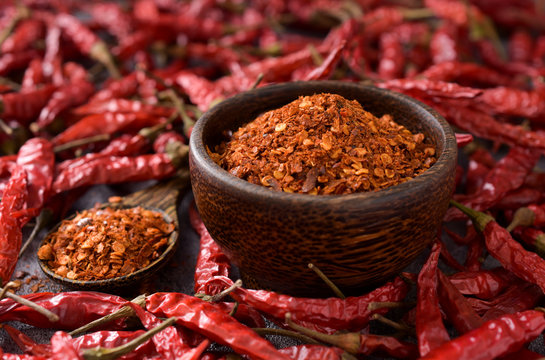 Close up,Cayenne pepper (Ground chili) and dried chili on a black background,copy space.