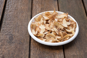 Potato peels - good compost material. Wooden background