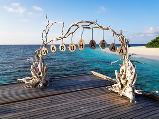 MALE, MALDIVES - Oct 13, 2018: Welcome board in Outrigger Konotta Maldives Resort in local language.