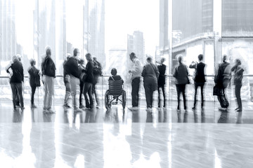 group of people in the lobby business center in monochrome blue tonality