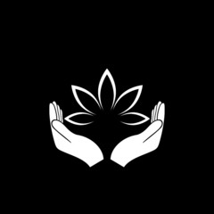 Hands holding a beautiful lotus flower icon isolated on dark background