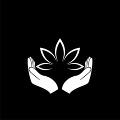 Hands holding a beautiful lotus flower icon isolated on dark background