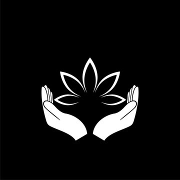 Hands holding a beautiful lotus flower icon isolated on dark background