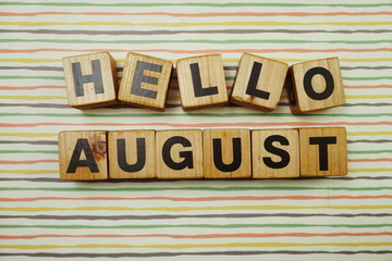 Hello August alphabet letters on colorful stripes background