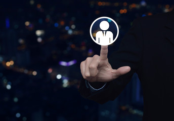 Hand click businessman flat icon over blur colorful night light modern city tower and skyscraper, Business communication concept