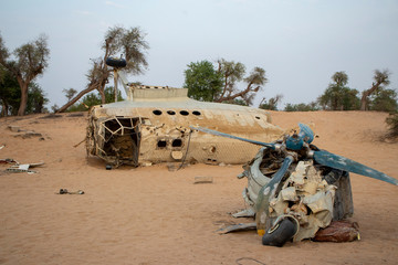 Small airplane wreckage in the deserted area of Dubai city.