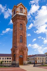 Fototapeta premium Old water tower on Cathedral Square close-up on a sunny July morning. Staraya Russa, Russia