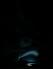 A somke like a flame with dark background