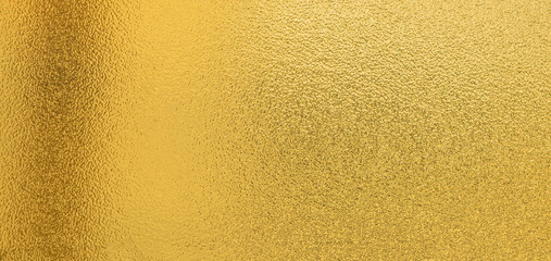 Gold texture background with yellow luxury shiny shine glitter sparkle of bright light reflection on golden surface, for celebration backdrop,