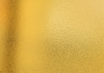 Gold texture background with yellow luxury shiny shine glitter sparkle of bright light reflection...