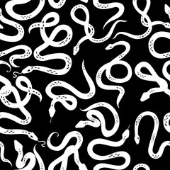 Seamless pattern with various snakes or serpents on black background. Botanical background on tropical theme. Black and white snake. Boho flat design for fabric, textile, wrapping paper, wallpaper
