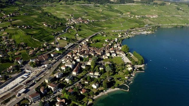 Cully Village Waterfront Houses Along The Lake Leman In Lavaux Vineyard Terraces, Switzerland - aerial drone shot