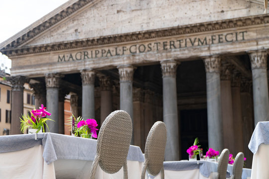 tables set with flowers in front of the pantheon, Rome , Italy