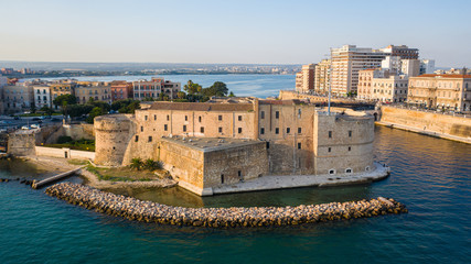 Beautiful panoramic aerial view photo from flying drone on Old medieval Aragonese Castle on sea...