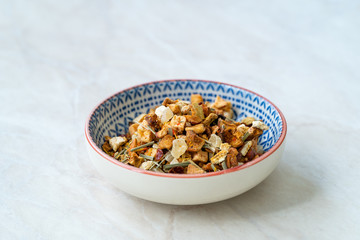 Refreshing Dry Tea Satsuma, Pineapple and Apple in Bowl served for Cold Tea in Summer.