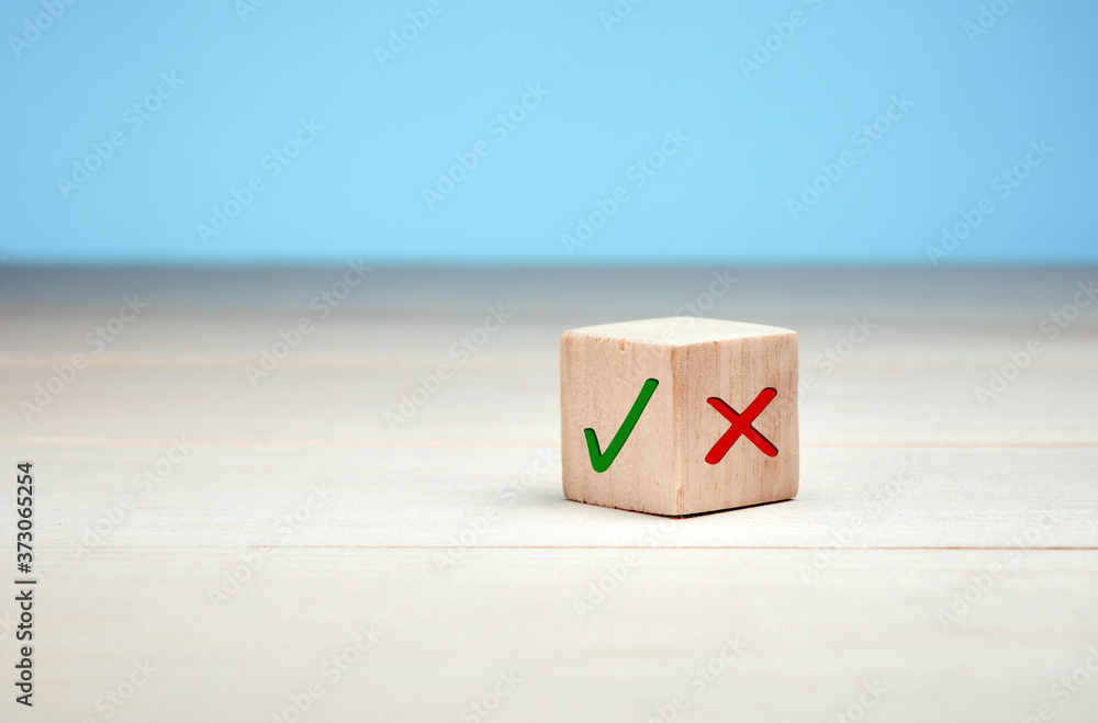 Poster wooden block with green check mark and red x. choice and decision making concept.