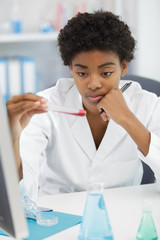 female doctor doing the blood test in medical laboratory